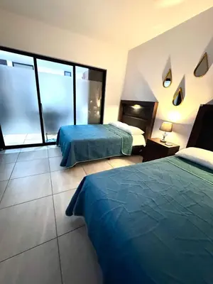 Cama o camas de una habitación en Loft, Departamento cerca del Malecon, MAZATLAN