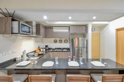 Una cocina o zona de cocina en Bonito condo Zona Dorada con Piscina y Cochera