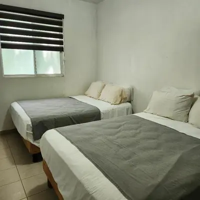 Cama o camas de una habitación en Hospedaje Parras