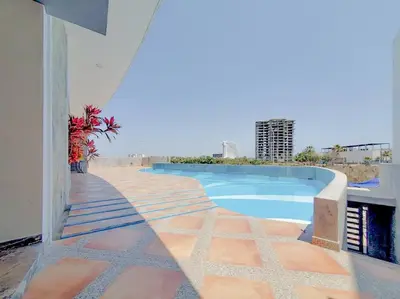 Piscina en o cerca de Lindo Condo a 1 cuadra de la playa