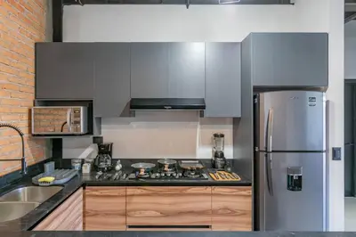 Una cocina o zona de cocina en Depa Industrial Moderno y Comodo