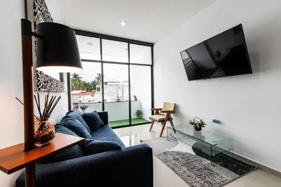Una televisión o centro de entretenimiento en Departamento a 2 minutos de la playa by G P S rentas
