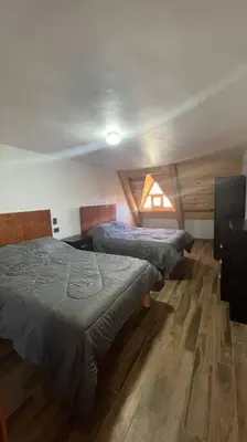 Cama o camas de una habitación en Cabaña Alpina