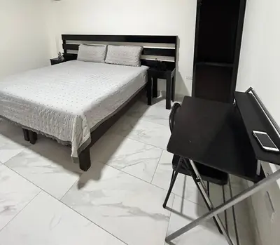Cama o camas de una habitación en HOTEL and Suites Cananea