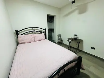 Cama o camas de una habitación en HOTEL and Suites Cananea