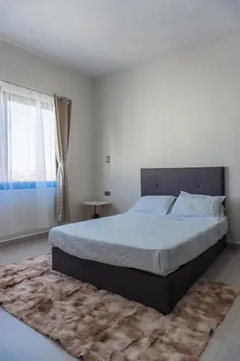 Cama o camas de una habitación en Spacious family apartment in Mazatlán