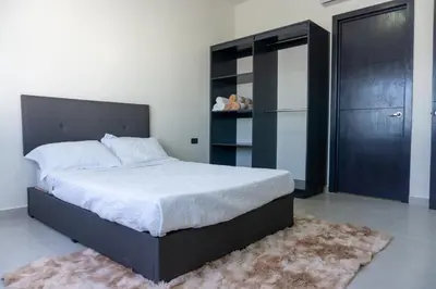 Cama o camas de una habitación en Spacious family apartment in Mazatlán