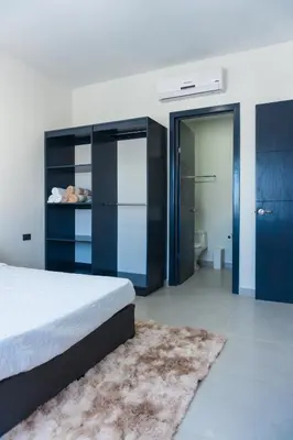 Cama o camas de una habitación en Spacious family apartment in Mazatlán