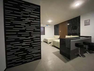 Cama o camas de una habitación en Apartamentos AEROPUERTO