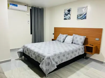 Cama o camas de una habitación en Apartamentos AEROPUERTO