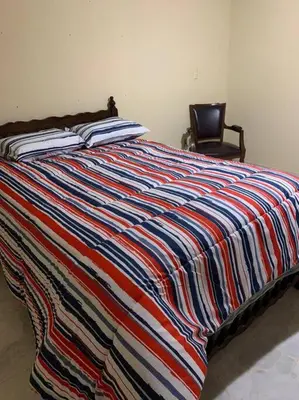 Cama o camas de una habitación en La casa del cerro con vista al oceano pacifico