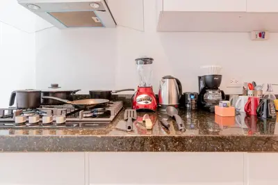 Una cocina o zona de cocina en LOFT ULTRA Moderno y Minimalista con 2 Camas KING Size