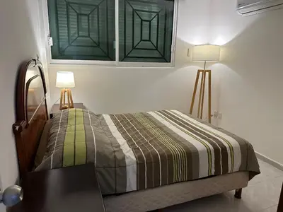 Cama o camas de una habitación en Apto comodo, muy cerca de playa 101