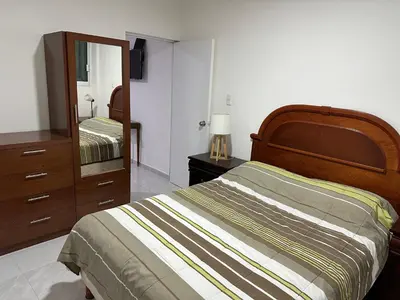 Cama o camas de una habitación en Apto comodo, muy cerca de playa 101