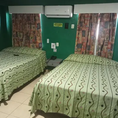 Cama o camas de una habitación en Hotel Viena