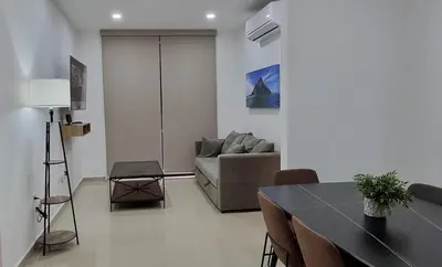 Zona de estar de Confortable Departamento