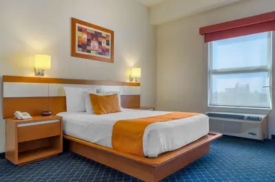 Cama o camas de una habitación en Greenwood Hotel Torreón