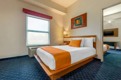 Cama o camas de una habitación en Greenwood Hotel Torreón