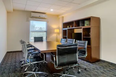 Una televisión o centro de entretenimiento en Greenwood Hotel Torreón