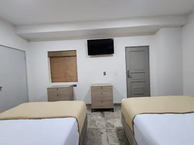 Cama o camas de una habitación en Hotel Roque