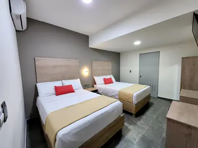 Cama o camas de una habitación en Hotel Roque