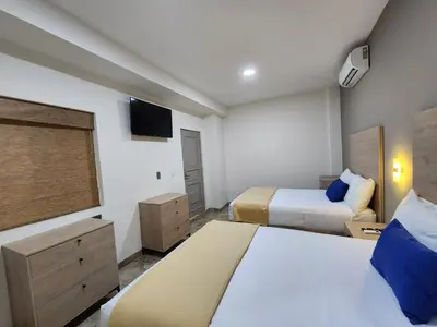 Cama o camas de una habitación en Hotel Roque