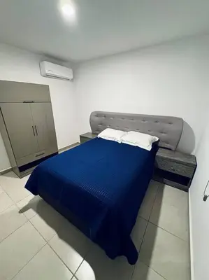 Cama o camas de una habitación en E&S Estancia vacacional