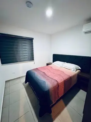 Cama o camas de una habitación en E&S Estancia vacacional