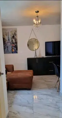 Una televisión o centro de entretenimiento en Santa Clara Apt