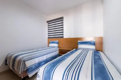 Cama o camas de una habitación en para relajarse muy cerca de la playa by G P S rentas
