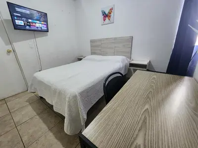 Cama o camas de una habitación en Casa céntrica, en privada con acceso controlado