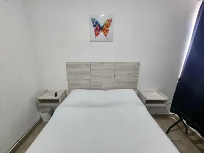 Cama o camas de una habitación en Casa céntrica, en privada con acceso controlado
