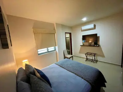 Cama o camas de una habitación en Ground floor apartment close to the beach, shops and restaurants