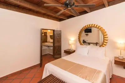 Cama o camas de una habitación en Hotel 1697 Loreto