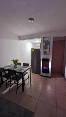 Zona de estar de Acogedora Casa