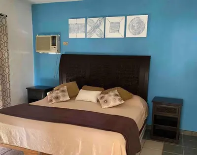 Cama o camas de una habitación en Casa Playa Las Glorias. Vista al mar