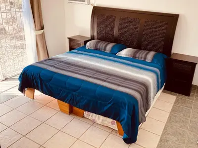 Cama o camas de una habitación en Casa Playa Las Glorias. Vista al mar