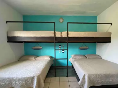 Cama o camas de una habitación en Casa Playa Las Glorias. Vista al mar