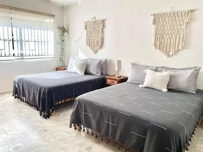 Cama o camas de una habitación en Ecosuite 2, Near the beach and shared terrace.