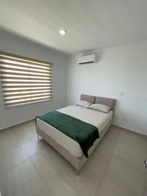 Cama o camas de una habitación en ALMARENA RESIDENCIAL