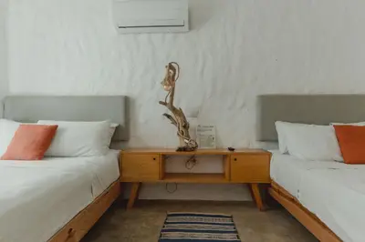 Cama o camas de una habitación en Toninas México Bungalow