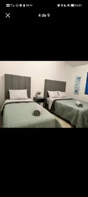 Cama o camas de una habitación en Casa Huesped San Marcos