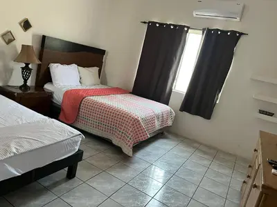 Cama o camas de una habitación en Casa Huesped San Marcos