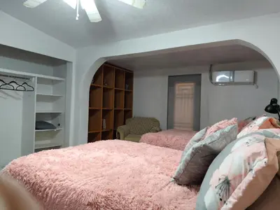 Cama o camas de una habitación en la casa de la tia Lucita