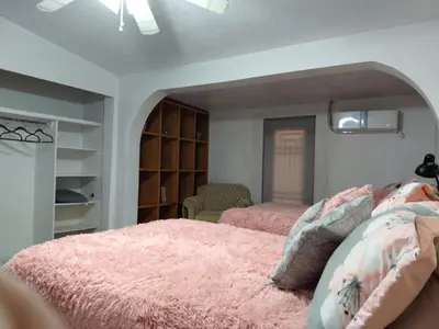 Cama o camas de una habitación en la casa de la tia Lucita