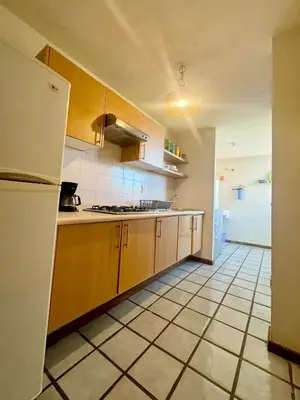 Una cocina o zona de cocina en Acogedor departamento cerca de la playa