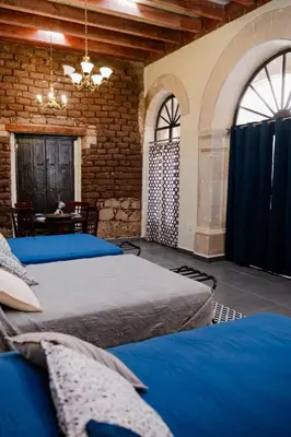 Cama o camas de una habitación en Hotel Boutique Casona los Pavorreales