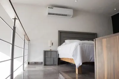 Cama o camas de una habitación en Departamentos Madero