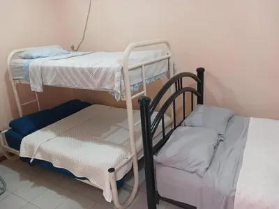 Cama o camas de una habitación en ALOJAMIENTO CERCA DE LA PLAYA