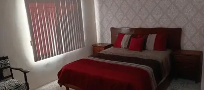 Cama o camas de una habitación en Departamento J y L